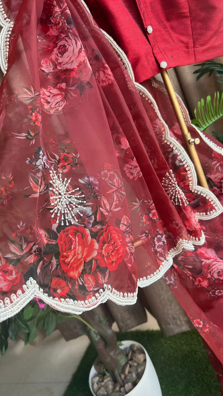 Deep maroon floral organza saree with hand worked blouse