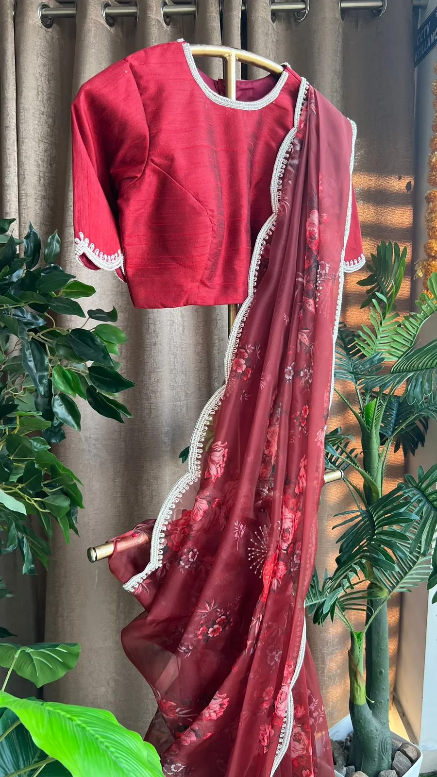 Deep maroon floral organza saree with hand worked blouse