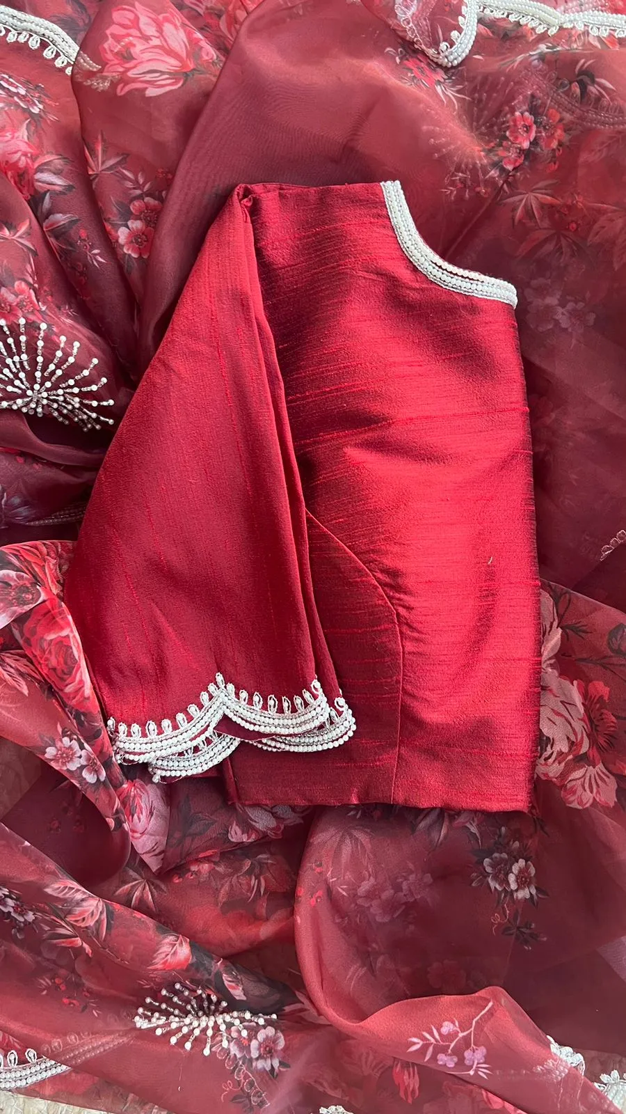 Deep maroon floral organza saree with hand worked blouse