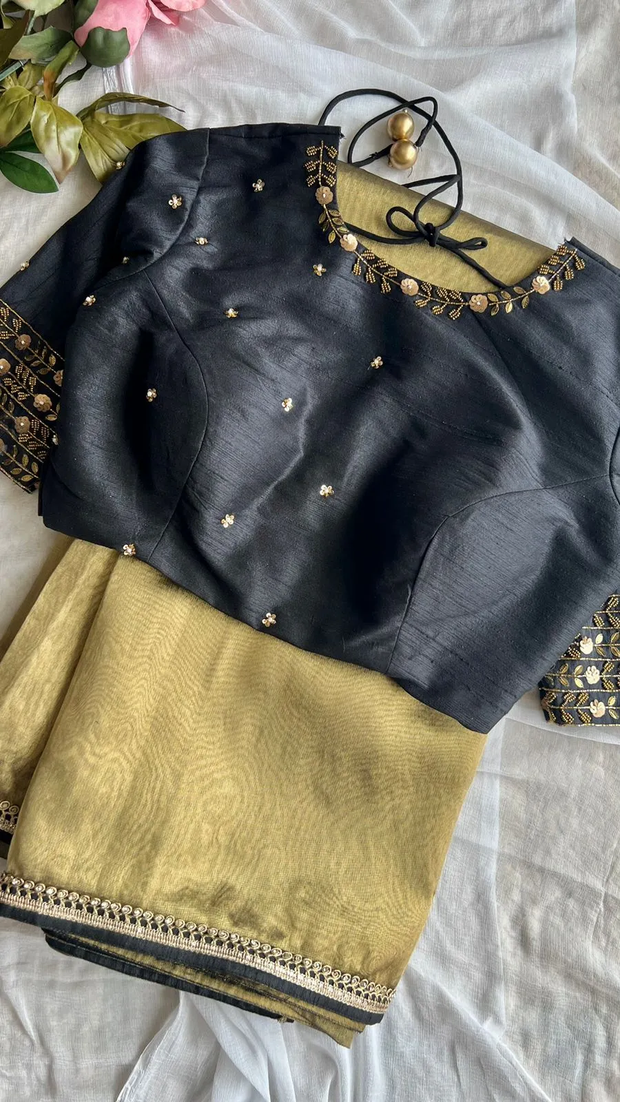 Gold tissue saree with black handwork blouse