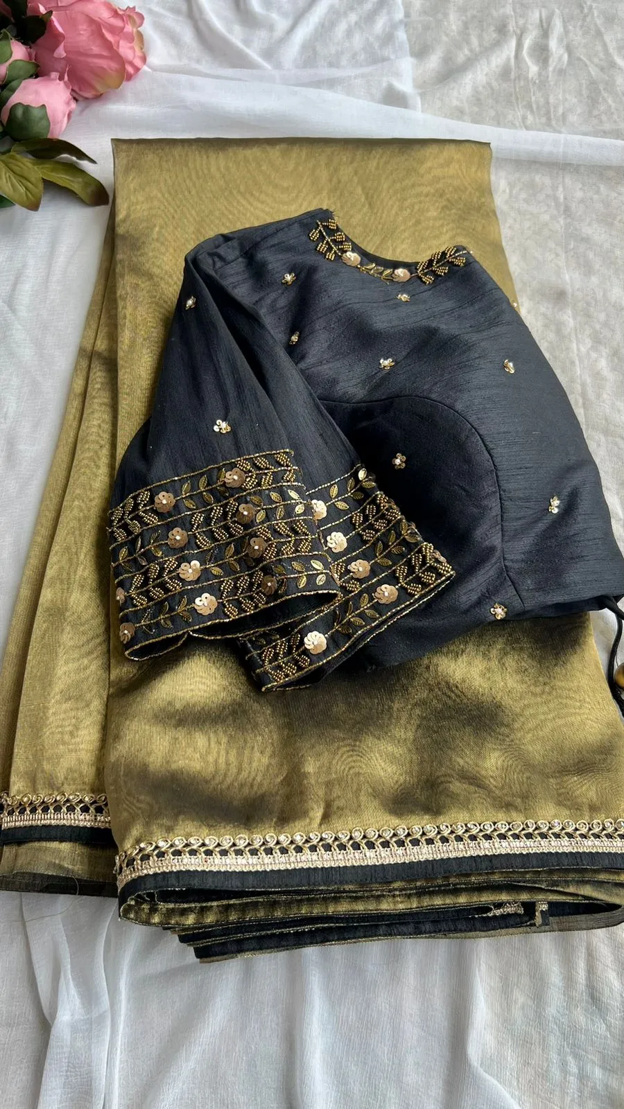 Gold tissue saree with black handwork blouse