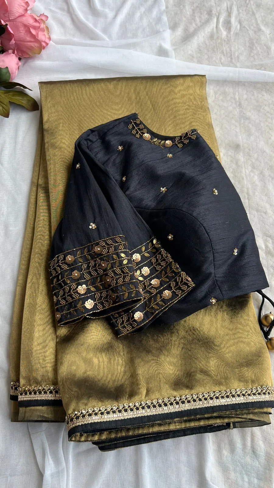 Gold tissue saree with black handwork blouse