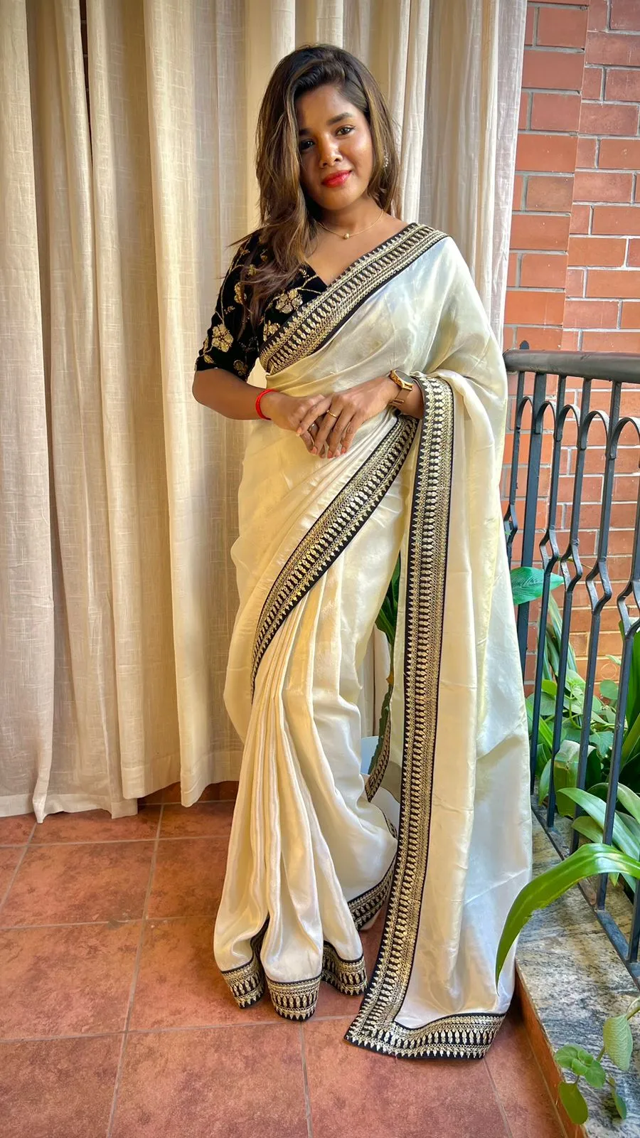 Golden silk saree with black hand work blouse