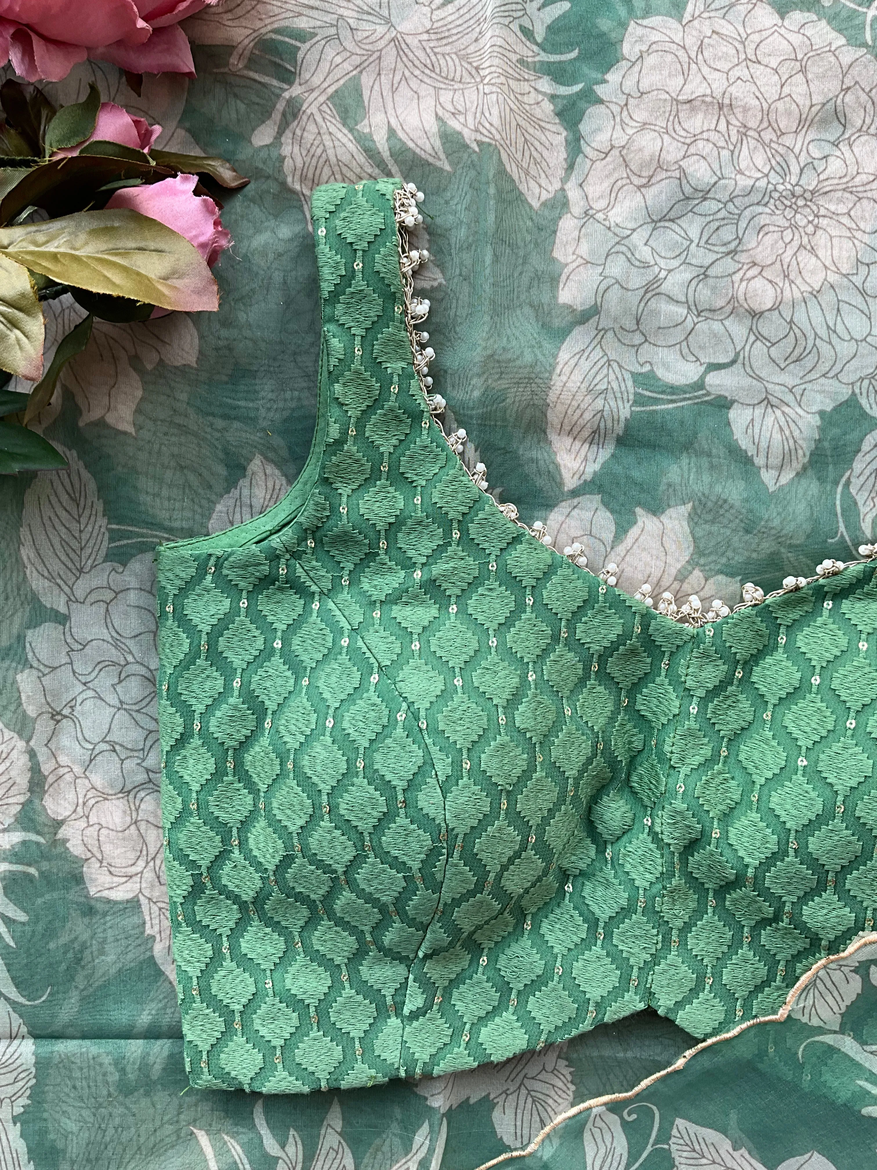 Green floral organza saree with emerald embroidery blouse